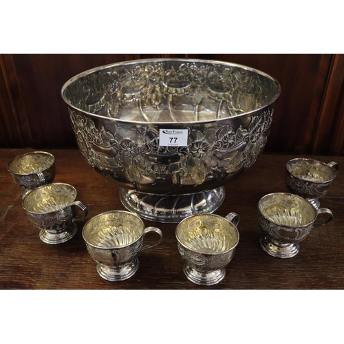 77 - Viners of Sheffield hand chased punch bowl, together with a set of six matching cups. (7)
(B.P. 21% ... 