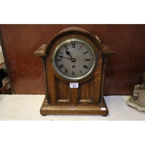 91 - Early 20th century oak single train bracket type clock with silvered face and roman numbers, standin... 