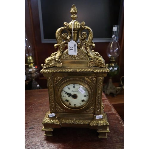 93 - Victorian style brass two-train 'imperial' mantel clock with pierced panels and dolphin mounts.
(B.P... 