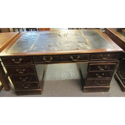 565 - Distressed mahogany knee hole desk having leather inset top in very poor condition above a bank of t... 