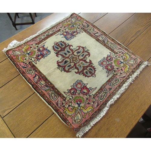 570 - Small multi-coloured floral and foliate temple mat. 59 x 66cm approx. 
(B.P. 21% + VAT)