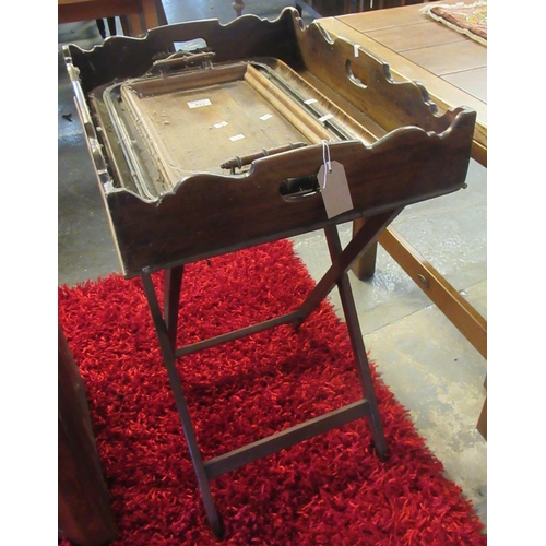 571 - Victorian mahogany butlers tray on stand, together  with three graduated wooden two handled trays. 
... 