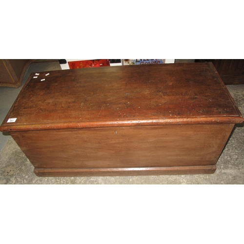 581 - 19th Century pine trunk of plain form with fitted candle box and metal carrying handles. 
(B.P. 21% ... 