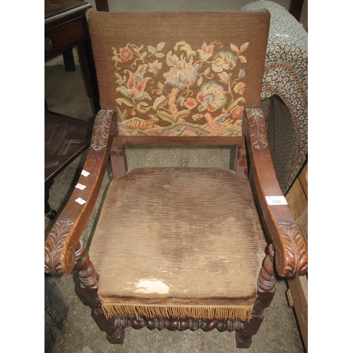 592 - Early 20th Century oak upholstered child's elbow chair with barley twist supports and stretchers. 
(... 