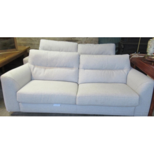 608 - A pair of Morton cream large two seater sofas. 
(B.P. 21% + VAT)