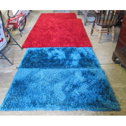 609 - Pair of Lagoon Indulgent blue ground shag pile rugs. 80 x 150cm approx. Together with two similar sp... 