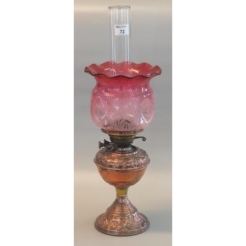 72 - Early 20th Century double oil burner having clear glass chimney above an etched cranberry glass and ... 