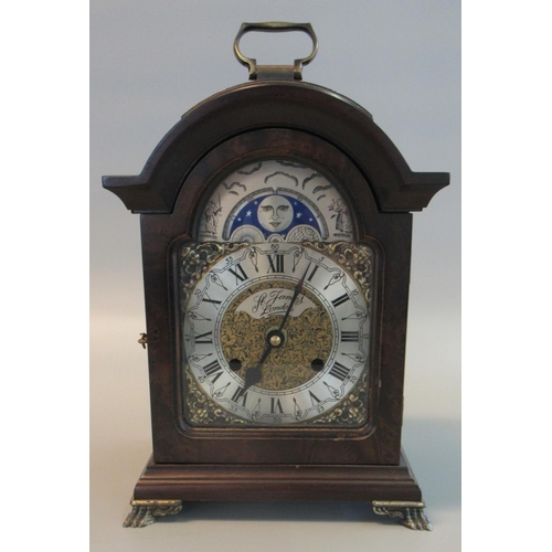 74 - Reproduction battery operated bracket type clock with moon face marked 'St James, London'.
(B.P. 21%... 