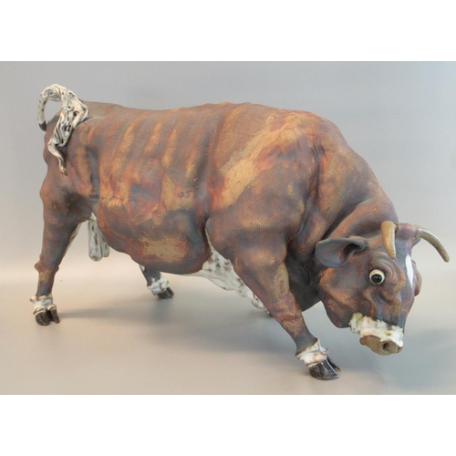 83 - Large art pottery study of a bull appearing to have an impressed monogram, 53cm long approx 
(B.P. 2... 