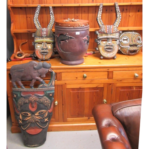 611 - A collection of carved and wooden tribal art items to include; drum with lizard decoration, masks wi... 