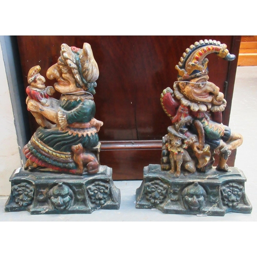 618 - Pair of cast metal doorstops in the form of Punch and  Judy.
(B.P. 21% + VAT)