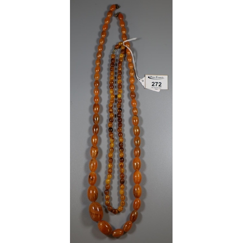 249 - Two strings of amber coloured resin beads.
 (B.P. 21% + VAT)