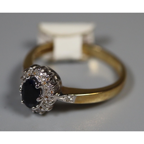 257 - 9ct gold sapphire and diamond cluster ring.  Ring size P.  Approx weight 3 grams.  
(B.P. 21% + VAT)