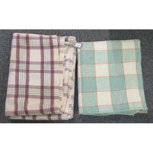 104 - Two vintage woollen check blankets or carthen in different colourways. (2)
(B.P. 21% + VAT)
