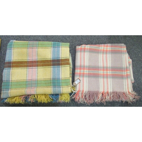 105 - Two check woollen blankets or carthen in various colours. (2)
(B.P. 21% + VAT)