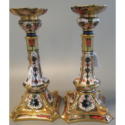 14 - A pair of Royal Crown Derby English bone china Imari candlesticks, 27cm high approx. (2)
(B.P. 21% +... 