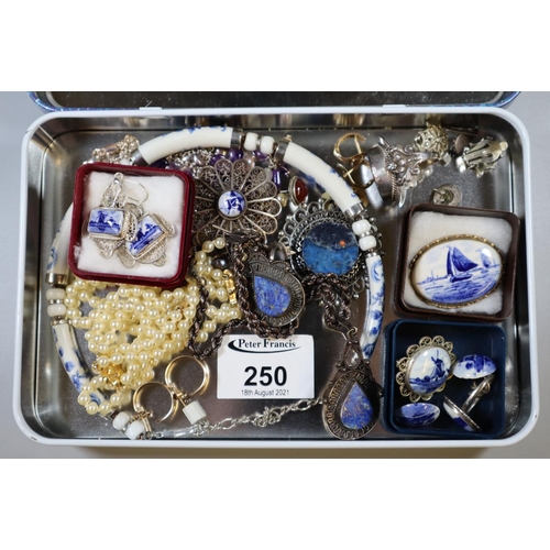 250 - Quimperware-style French tin box to include filigree brooch and other brooches in delft style, neckl... 