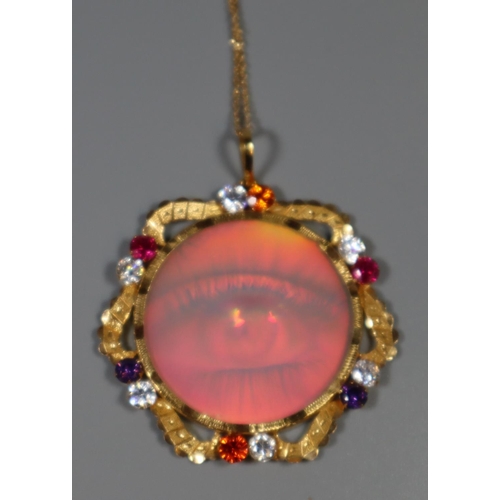 253 - Modern gilt metal stone set hologram pendant on gilt chain.
(B.P. 21% + VAT)