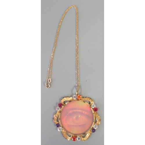 253 - Modern gilt metal stone set hologram pendant on gilt chain.
(B.P. 21% + VAT)