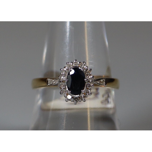 257 - 9ct gold sapphire and diamond cluster ring.  Ring size P.  Approx weight 3 grams.  
(B.P. 21% + VAT)