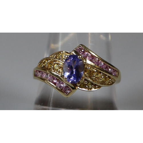 267 - Modern 9ct gold twist shank, stone set dress ring with amethyst-type central stone and pink small st... 