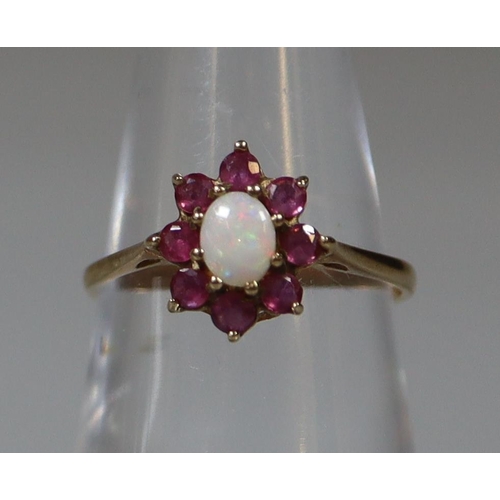 268 - 9ct gold opal and red stone dress ring, probably garnet. 1.4g approx.
(B.P. 21% + VAT)