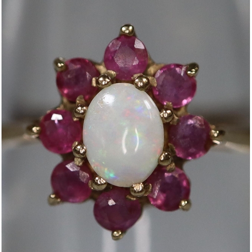 268 - 9ct gold opal and red stone dress ring, probably garnet. 1.4g approx.
(B.P. 21% + VAT)