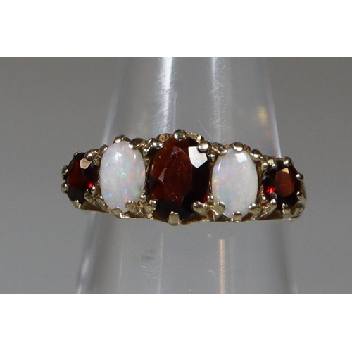 269 - Victorian design 9ct gold opal and garnet dress ring. 3g approx.
(B.P. 21% + VAT)