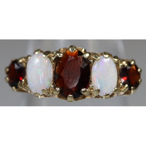 269 - Victorian design 9ct gold opal and garnet dress ring. 3g approx.
(B.P. 21% + VAT)