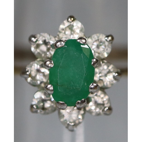 271 - 9ct gold flower head design dress ring, set with green central stone and small diamonds. 1.5g approx... 