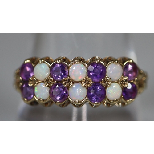 274 - 9ct gold Victorian design double row dress ring set with opals and purple stones. 2.1g approx.
(B.P.... 