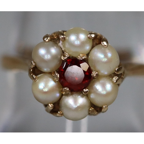 277 - 9ct gold seed pearl and garnet flowerhead design dress ring. 2.4g approx.
(B.P. 21% + VAT)