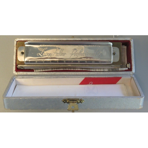 35 - The Larry Adler professional 12 Hohner chromatic harmonica, in original box. 
(B.P. 21% + VAT)