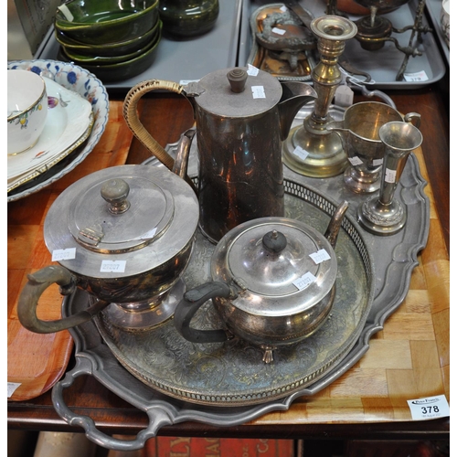 378 - Tray of silver plate to include: two-handled tray, candlesticks, helmet shaped cream jug, specimen v... 