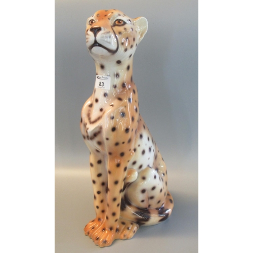 83 - Modern ceramic study of a seated cheetah. 49cm high approx. 
(B.P. 21% + VAT)