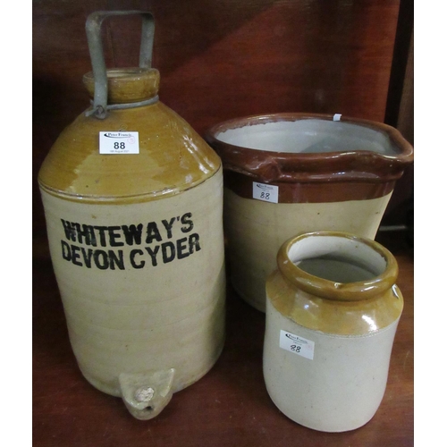 88 - Whiteway's Devon cider two tone stoneware flagon,  together with a stoneware utensil jar and another... 
