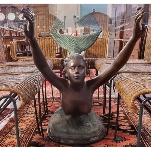 475 - An unusual contemporary glass top table, the base decorated with a bronzed mermaid on marble finish ... 