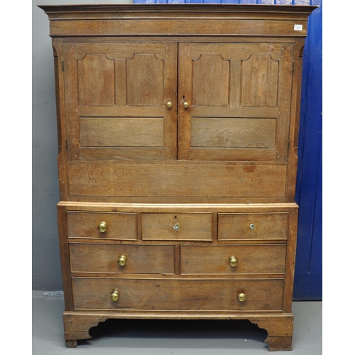 477 - Early 19th Century Welsh oak two stage press cupboard, the moulded cornice above two blind panelled ... 