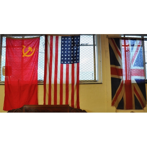 481 - A large collection of national flags and bunting, originally displayed on a Carmarthen home at the t... 