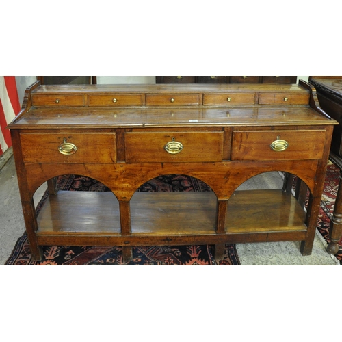 482 - 19th Century Welsh oak and other mixed woods dresser base having a row of five spice drawers to the ... 