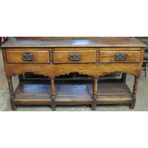 483 - Early 19th Century Welsh oak pot board dresser base, having moulded edge top above three moulded fri... 