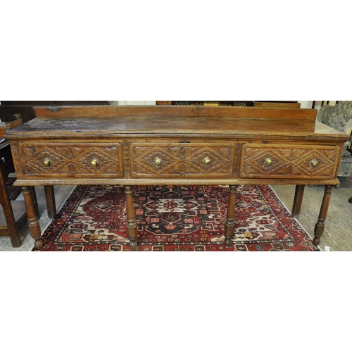 486 - 18th Century English oak and elm three drawer dresser base with associated low back, moulded edge to... 