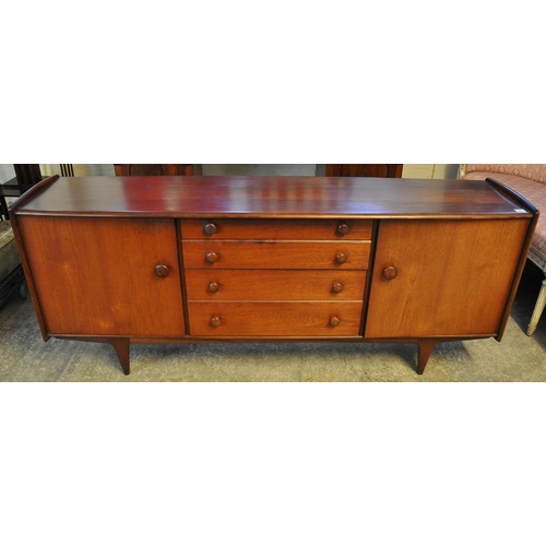 494 - G Plan style teak sideboard, the bow front top flanked by two blind panelled doors and four graduate... 