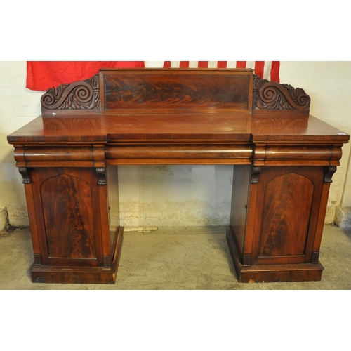 495 - 19th Century mahogany twin pedestal sideboard, the carved gallery back above a break front top, with... 