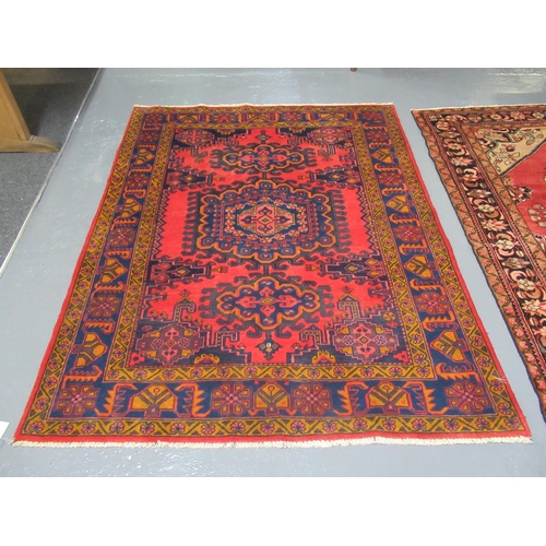 510 - Middle Eastern design Viss on a red ground with mulit-coloured geometric flower head and other desig... 