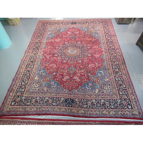 519 - Middle Eastern design Mashad carpet of large proportions on a multi-coloured ground decorated with v... 