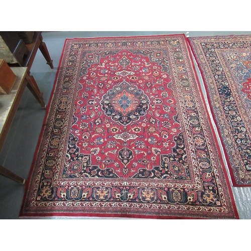 525 - Middle Eastern design Mashad carpet mainly on a red and blue ground decorated with large central med... 