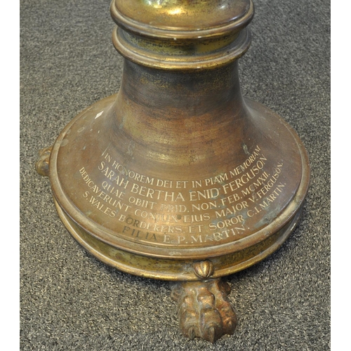 526 - Unusual heavy gilt brass memorial lectern, the pediment with a study of a perched eagle with outswep... 