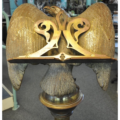 526 - Unusual heavy gilt brass memorial lectern, the pediment with a study of a perched eagle with outswep... 