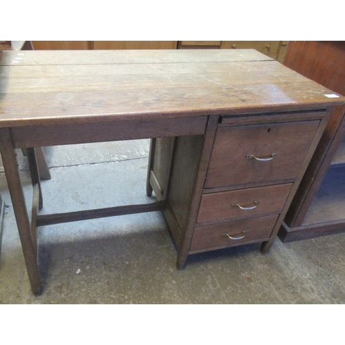 675 - Early 20th Century oak single pedestal desk with brush slide and three straight fronted drawers. 
(B... 